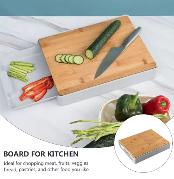 Bamboo Cutting Board With Drawer with vegetables and a knife on a white surface
